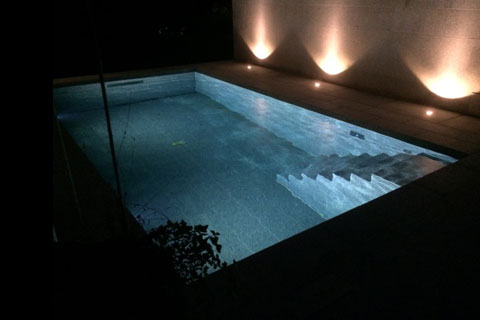 swimming pool at night with lights