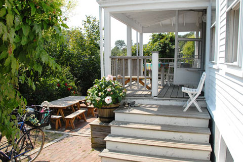 white wooden porch, staicase to garden