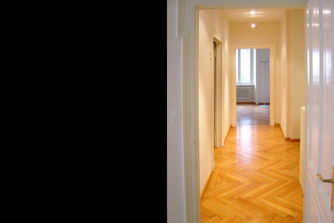 white painted wooden hallway and parquet floor